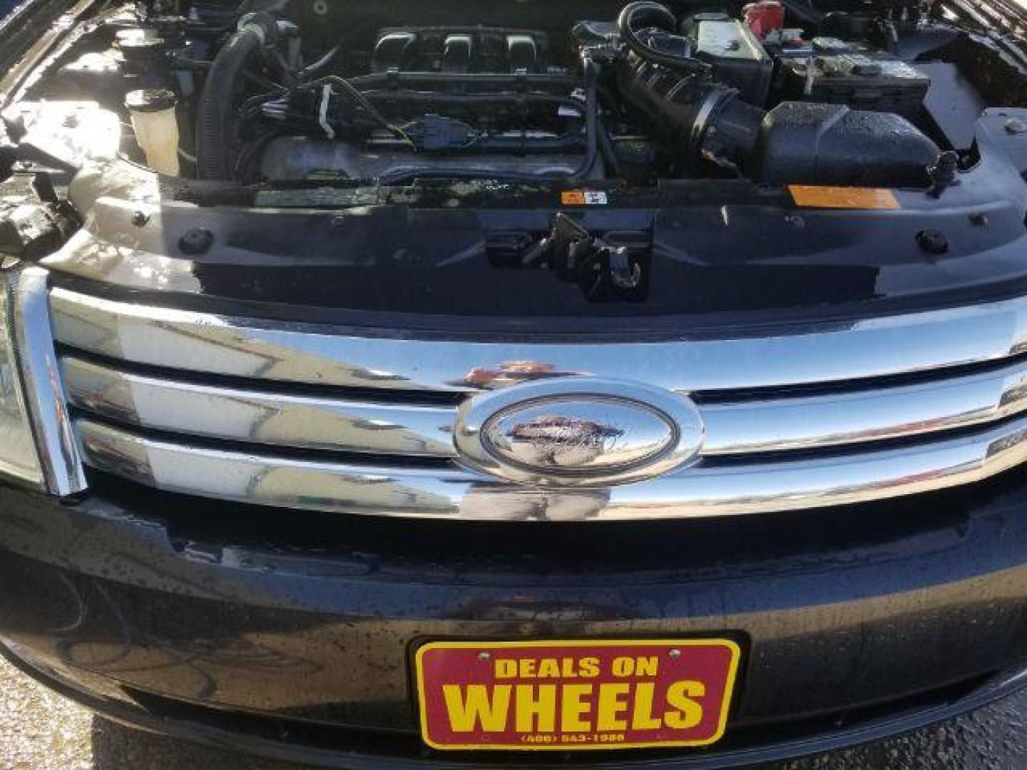 2009 Ford Taurus SEL (1FAHP27W59G) with an Duratec 3.5L V-6 DOHC engine, located at 4047 Montana Ave., Billings, MT, 59101, 45.770847, -108.529800 - Photo#13