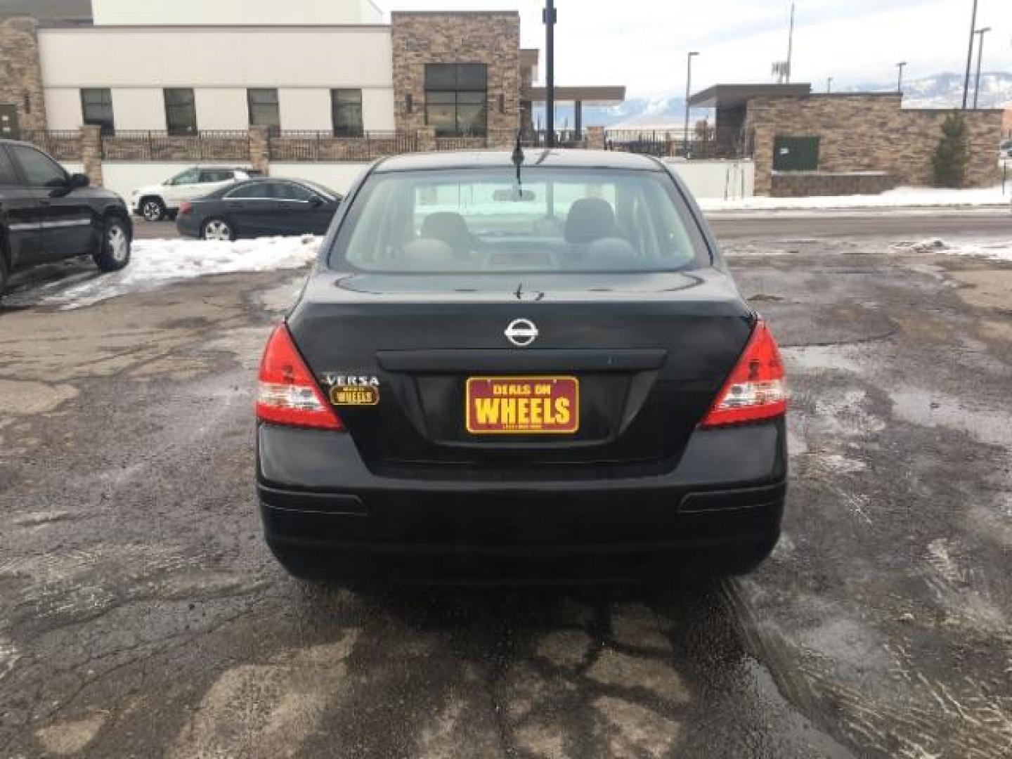 2009 Nissan Versa 1.6 Base Sedan (3N1CC11EX9L) with an 1.6L L4 DOHC 16V engine, Automatic transmission, located at 1800 West Broadway, Missoula, 59808, (406) 543-1986, 46.881348, -114.023628 - Photo#4