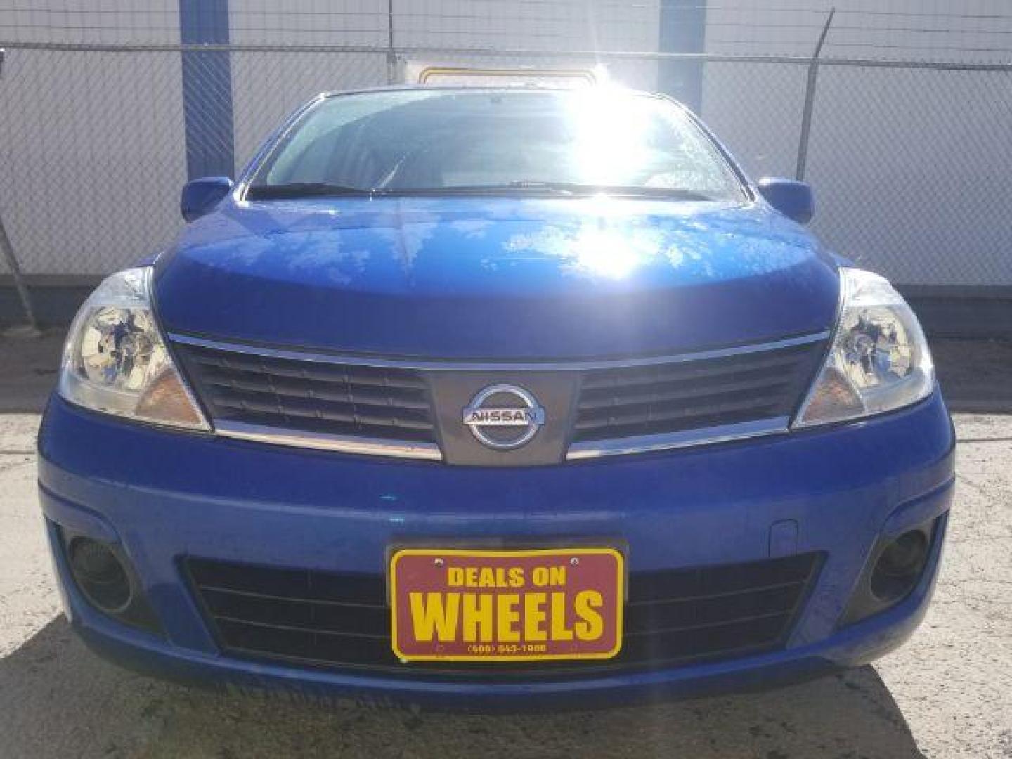 2009 Nissan Versa 1.8S (3N1BC13E19L) with an 1.8L I-4 DOHC engine, located at 1800 West Broadway, Missoula, 59808, (406) 543-1986, 46.881348, -114.023628 - Photo#1
