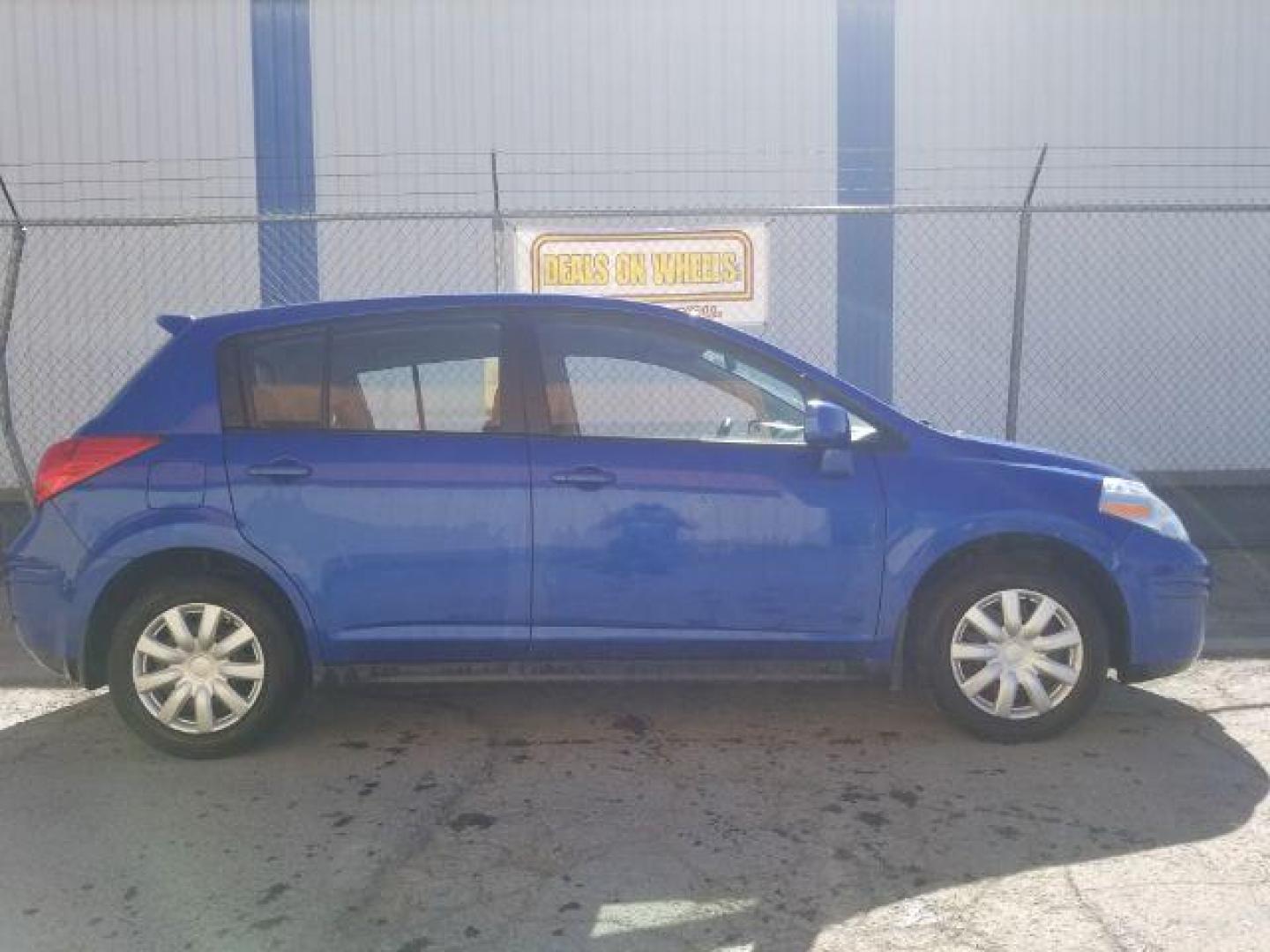2009 Nissan Versa 1.8S (3N1BC13E19L) with an 1.8L I-4 DOHC engine, located at 1800 West Broadway, Missoula, 59808, (406) 543-1986, 46.881348, -114.023628 - Photo#3