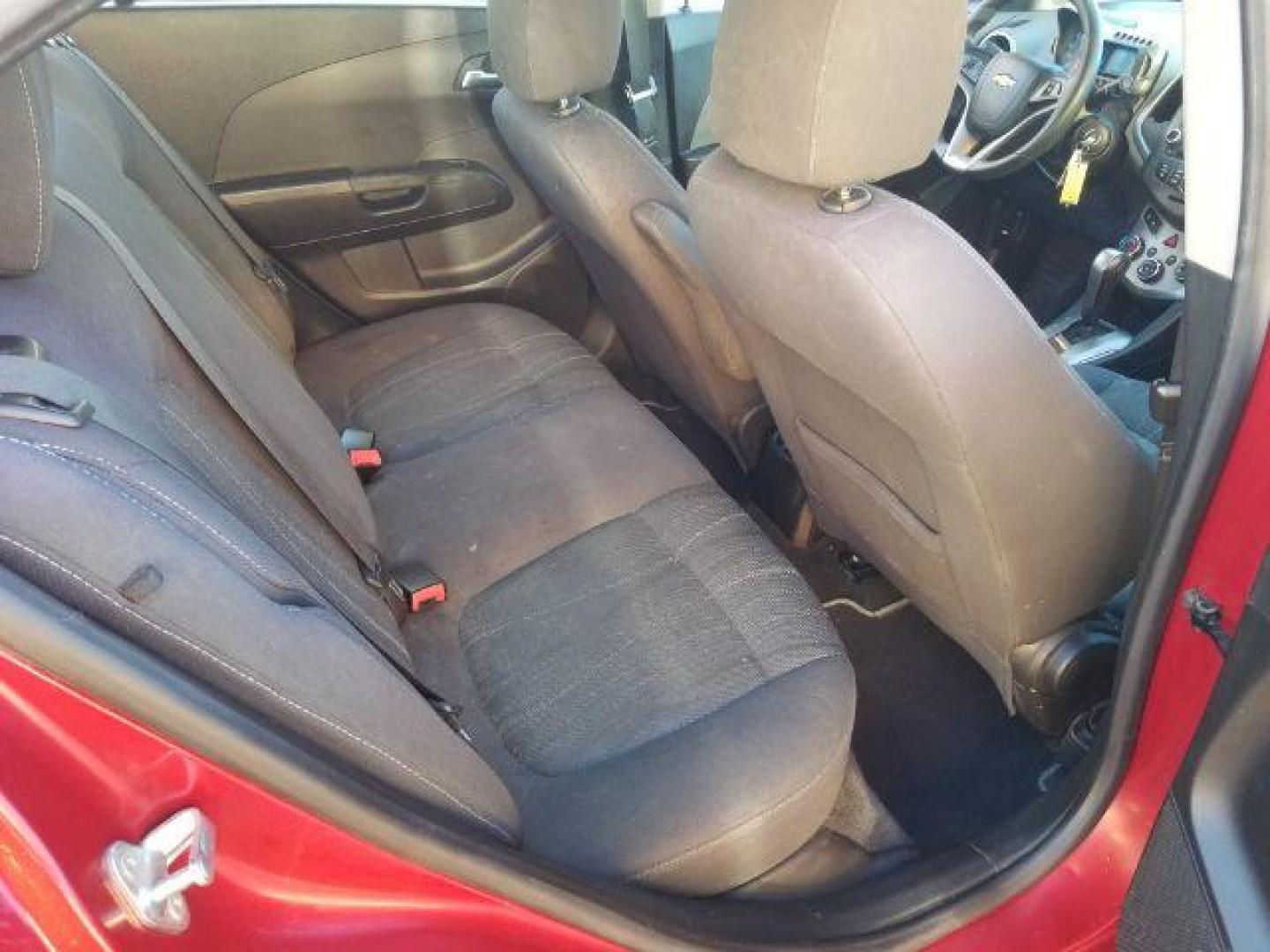 2012 Victory Red Chevrolet Sonic 2LT Sedan (1G1JC5SH9C4) with an 1.8L L4 DOHC 24V engine, 6-Speed Automatic transmission, located at 1821 N Montana Ave., Helena, MT, 59601, (406) 422-1031, 0.000000, 0.000000 - Photo#9