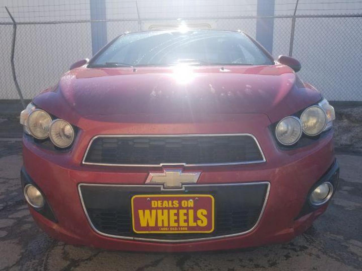 2012 Victory Red Chevrolet Sonic 2LT Sedan (1G1JC5SH9C4) with an 1.8L L4 DOHC 24V engine, 6-Speed Automatic transmission, located at 1821 N Montana Ave., Helena, MT, 59601, (406) 422-1031, 0.000000, 0.000000 - Photo#1