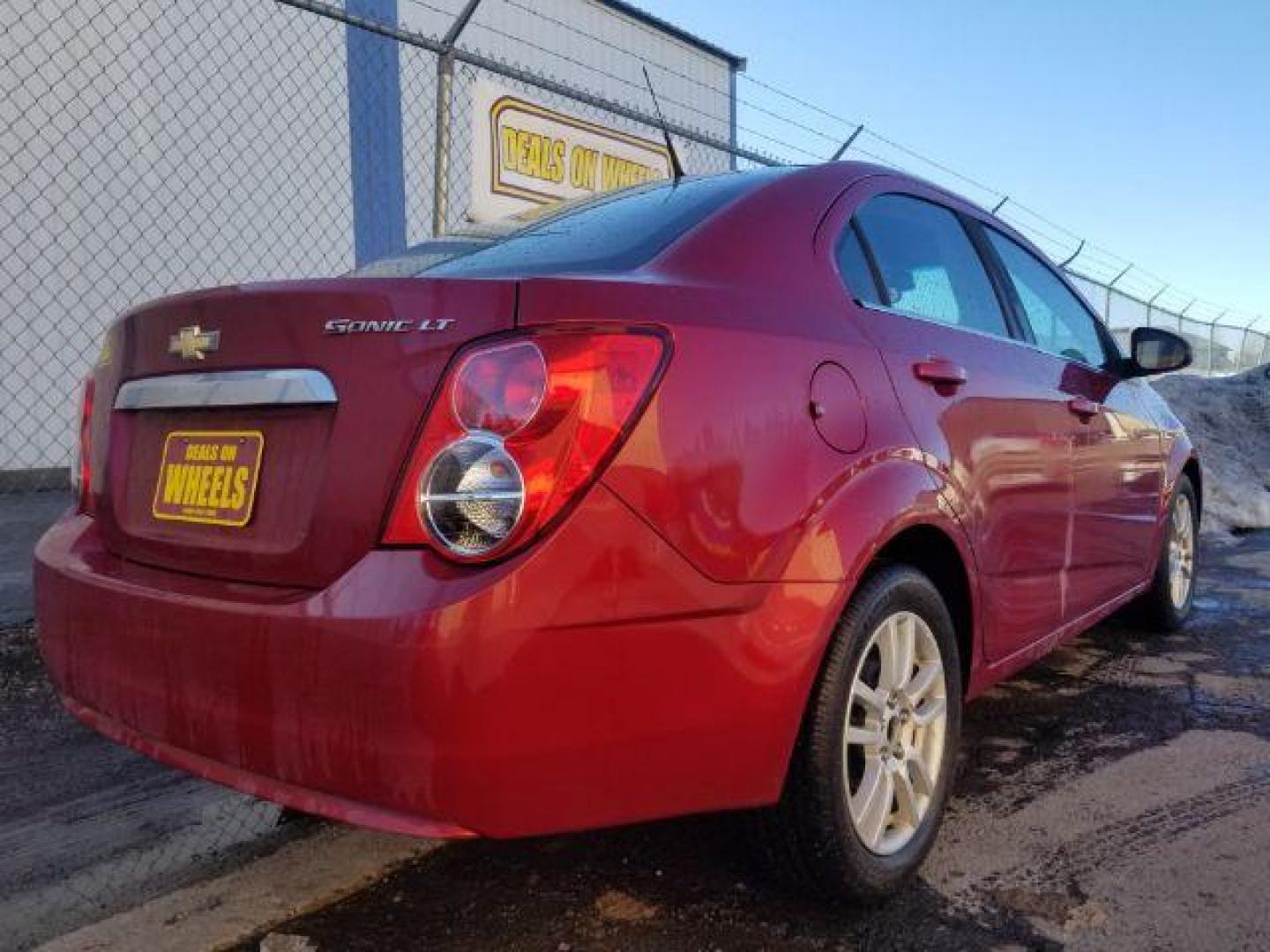 2012 Victory Red Chevrolet Sonic 2LT Sedan (1G1JC5SH9C4) with an 1.8L L4 DOHC 24V engine, 6-Speed Automatic transmission, located at 1821 N Montana Ave., Helena, MT, 59601, (406) 422-1031, 0.000000, 0.000000 - Photo#4