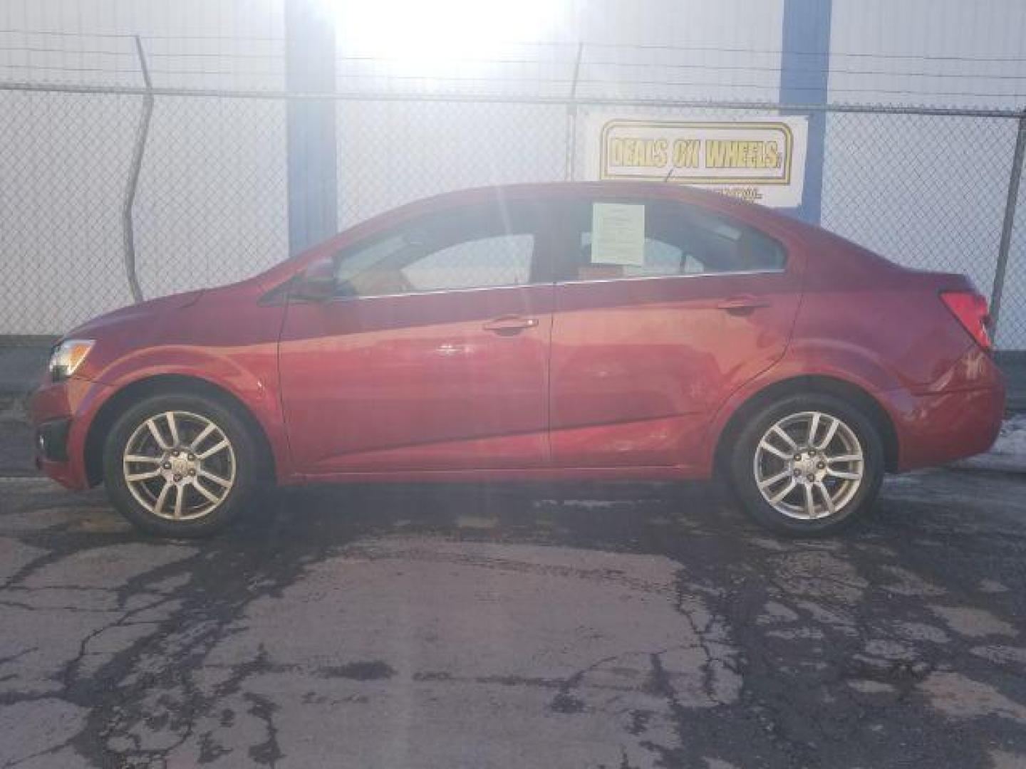 2012 Victory Red Chevrolet Sonic 2LT Sedan (1G1JC5SH9C4) with an 1.8L L4 DOHC 24V engine, 6-Speed Automatic transmission, located at 1821 N Montana Ave., Helena, MT, 59601, (406) 422-1031, 0.000000, 0.000000 - Photo#6