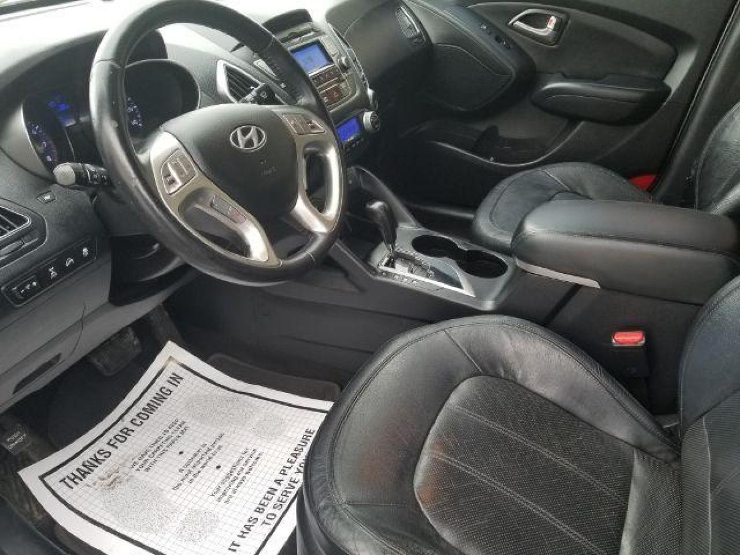 2012 Hyundai Tucson Limited (KM8JUCAC8CU) with an Theta II 2.4L I-4 DOHC engine, located at 1800 West Broadway, Missoula, 59808, (406) 543-1986, 46.881348, -114.023628 - Photo#6