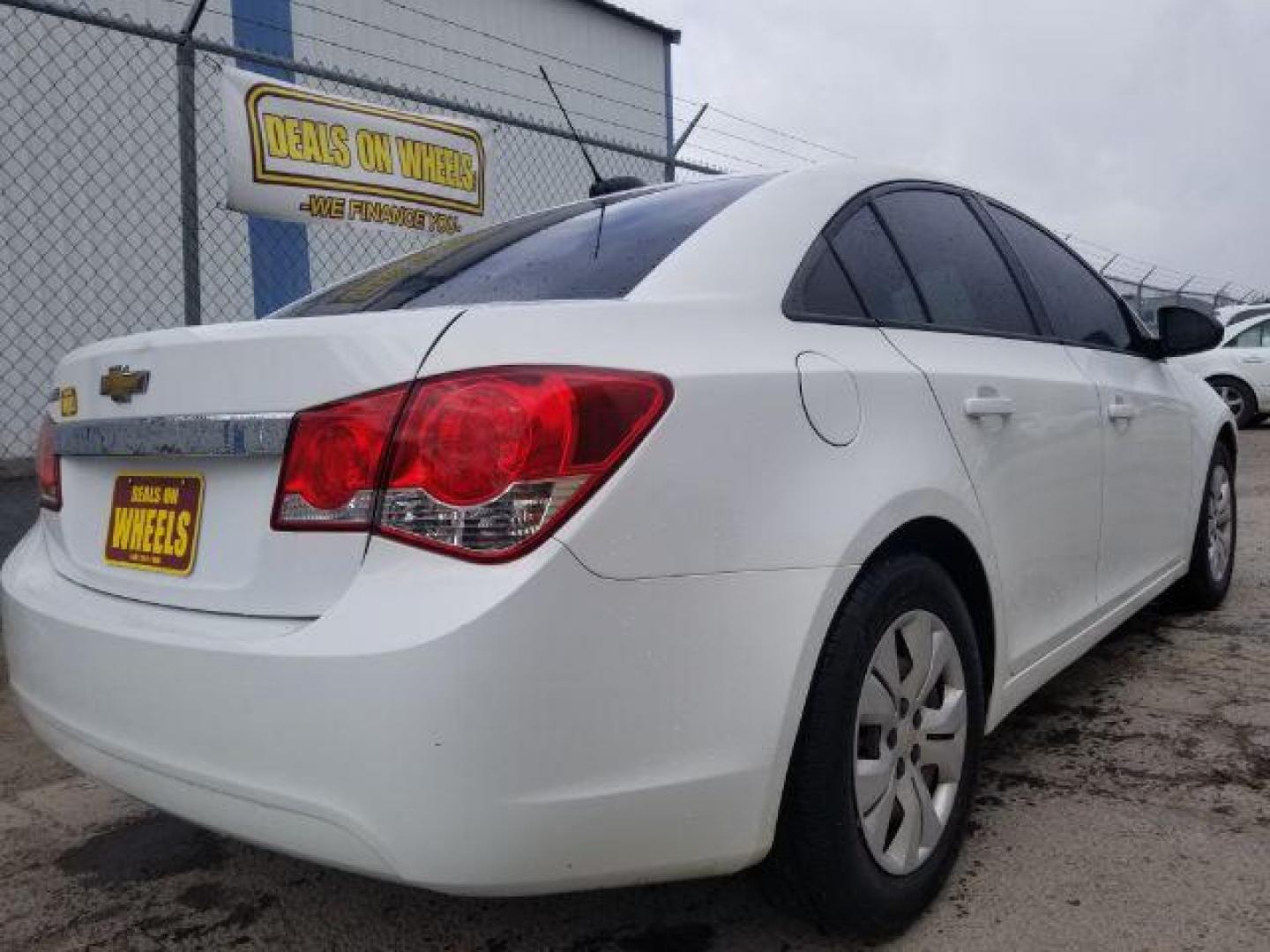 2016 Summit White Chevrolet Cruze Limited LS Auto (1G1PC5SG6G7) with an 1.8L L4 DOHC 16V FFV engine, 6-Speed Automatic transmission, located at 4047 Montana Ave., Billings, MT, 59101, 45.770847, -108.529800 - Photo#4