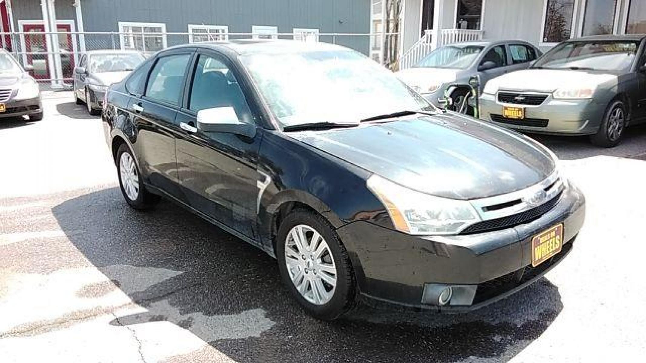 2009 BLACK FORD FOCUS SEL Sedan (1FAHP37N99W) , 4-Speed Automatic transmission, located at 1821 N Montana Ave, Helena, MT, 59601, (406) 422-1031, 46.603447, -112.022781 - Photo #2