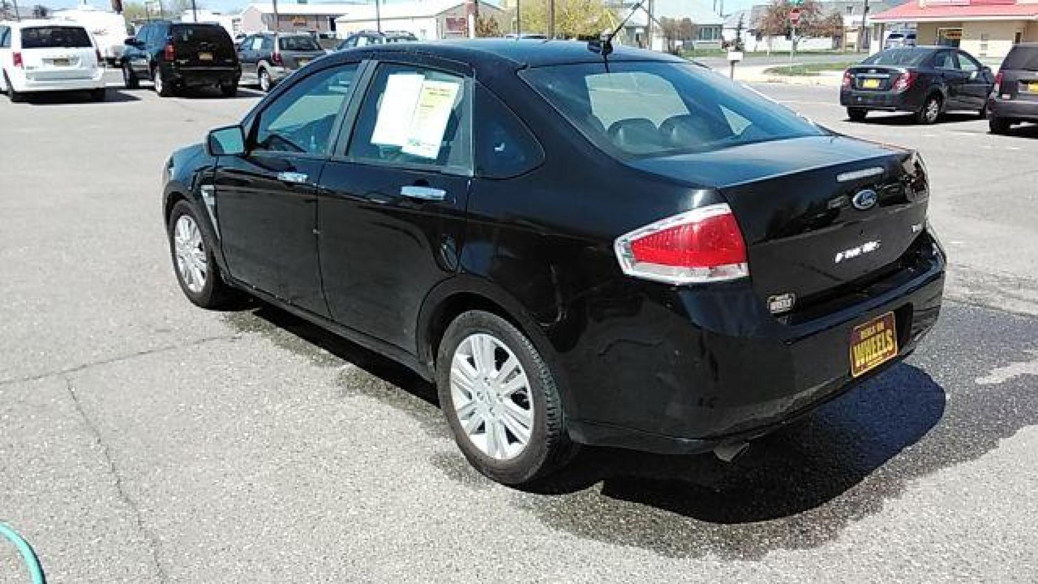 2009 BLACK FORD FOCUS SEL Sedan (1FAHP37N99W) , 4-Speed Automatic transmission, located at 1821 N Montana Ave, Helena, MT, 59601, (406) 422-1031, 46.603447, -112.022781 - Photo #6