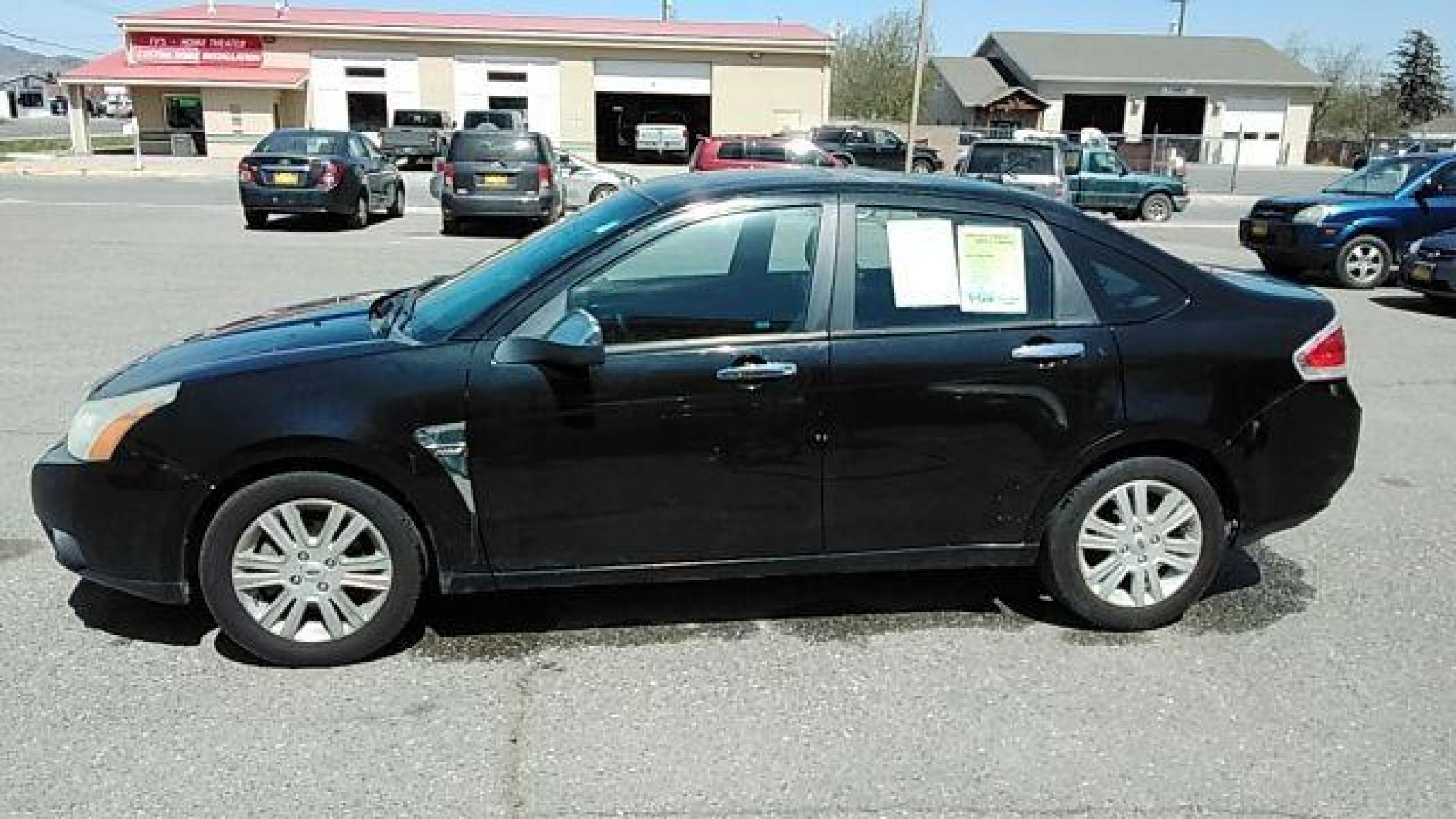 2009 BLACK FORD FOCUS SEL Sedan (1FAHP37N99W) , 4-Speed Automatic transmission, located at 1821 N Montana Ave, Helena, MT, 59601, (406) 422-1031, 46.603447, -112.022781 - Photo #7