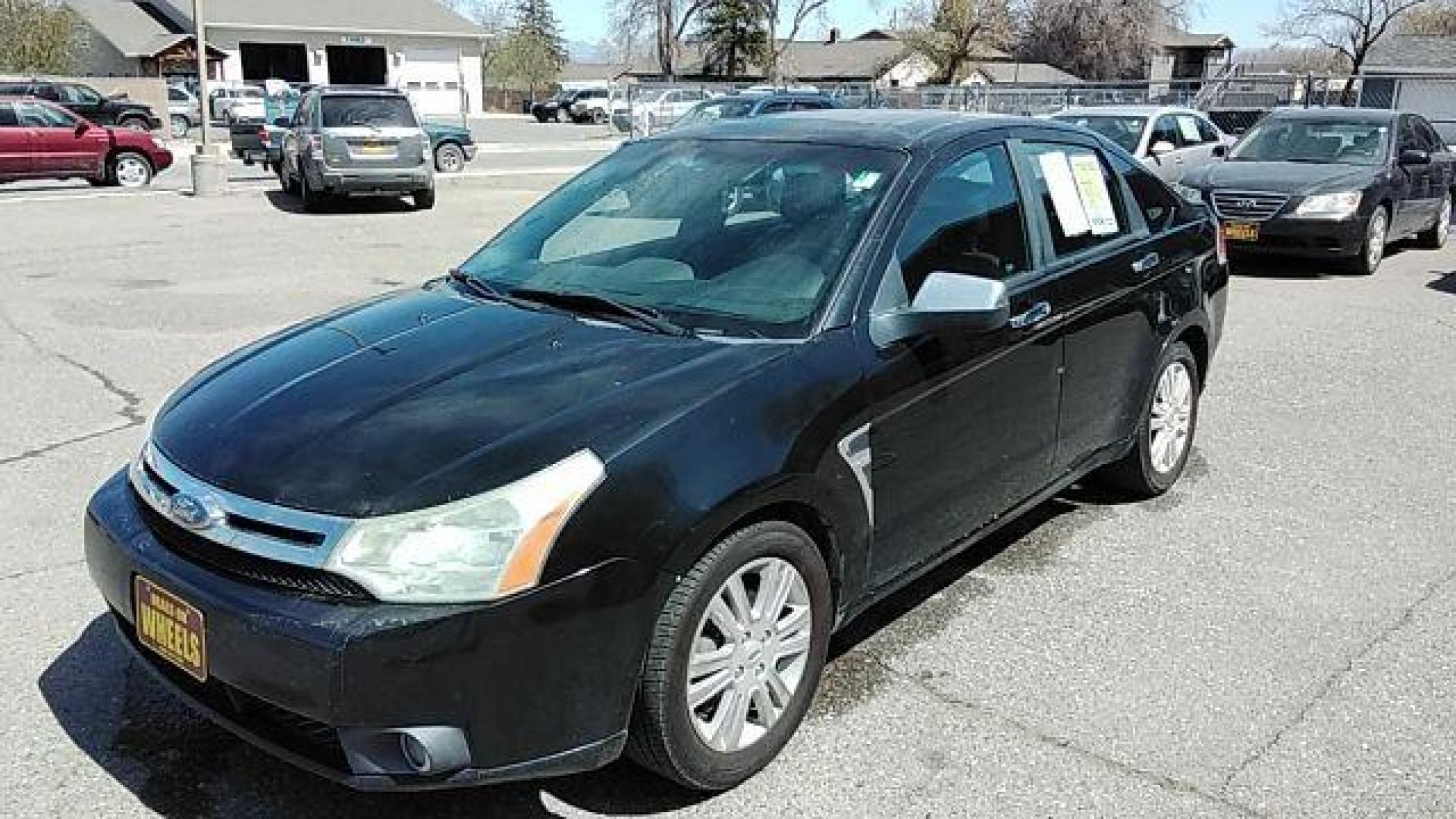 2009 BLACK FORD FOCUS SEL Sedan (1FAHP37N99W) , 4-Speed Automatic transmission, located at 1821 N Montana Ave, Helena, MT, 59601, (406) 422-1031, 46.603447, -112.022781 - Photo #0