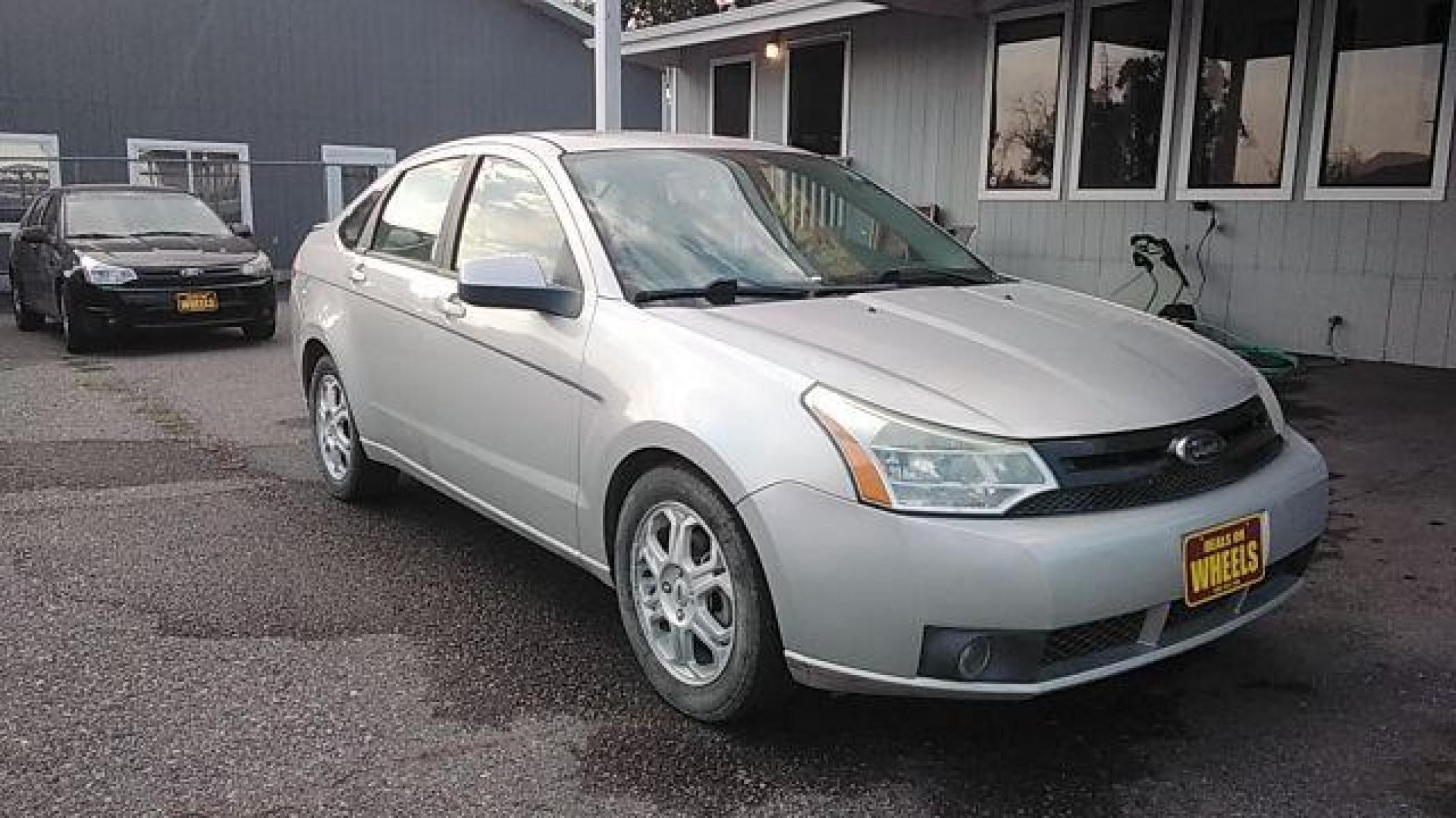 2009 Brilliant Silver Met Ford Focus SES Sedan (1FAHP36N89W) with an 2.0L L4 DOHC 16V engine, located at 1821 N Montana Ave, Helena, MT, 59601, (406) 422-1031, 46.603447, -112.022781 - Photo #2