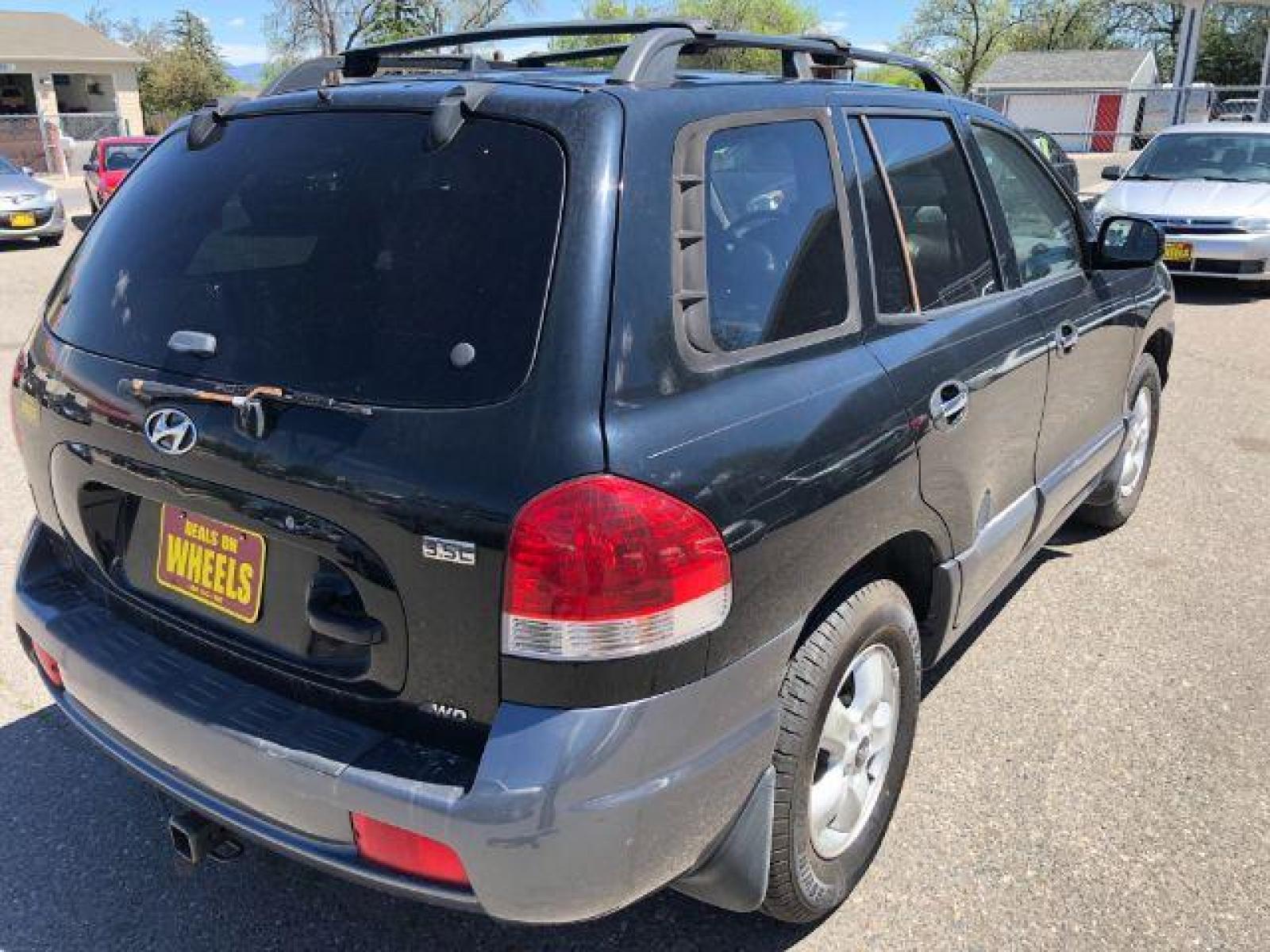 2005 Hyundai Santa Fe GLS 3.5L 4WD (KM8SC73E35U) with an 3.5L V6 DOHC 24V engine, 5-Speed Automatic transmission, located at 1821 N Montana Ave, Helena, MT, 59601, (406) 543-1986, 46.603153, -112.020531 - Photo #3