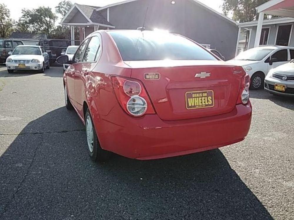2015 Red Hot Chevrolet Sonic LS Auto Sedan (1G1JA5SH2F4) with an 1.8L L4 DOHC 24V engine, 6-Speed Automatic transmission, located at 1821 N Montana Ave, Helena, MT, 59601, (406) 543-1986, 46.603153, -112.020531 - Photo #4