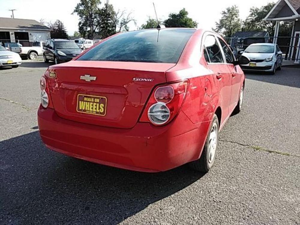2015 Red Hot Chevrolet Sonic LS Auto Sedan (1G1JA5SH2F4) with an 1.8L L4 DOHC 24V engine, 6-Speed Automatic transmission, located at 1821 N Montana Ave, Helena, MT, 59601, (406) 543-1986, 46.603153, -112.020531 - Photo #5