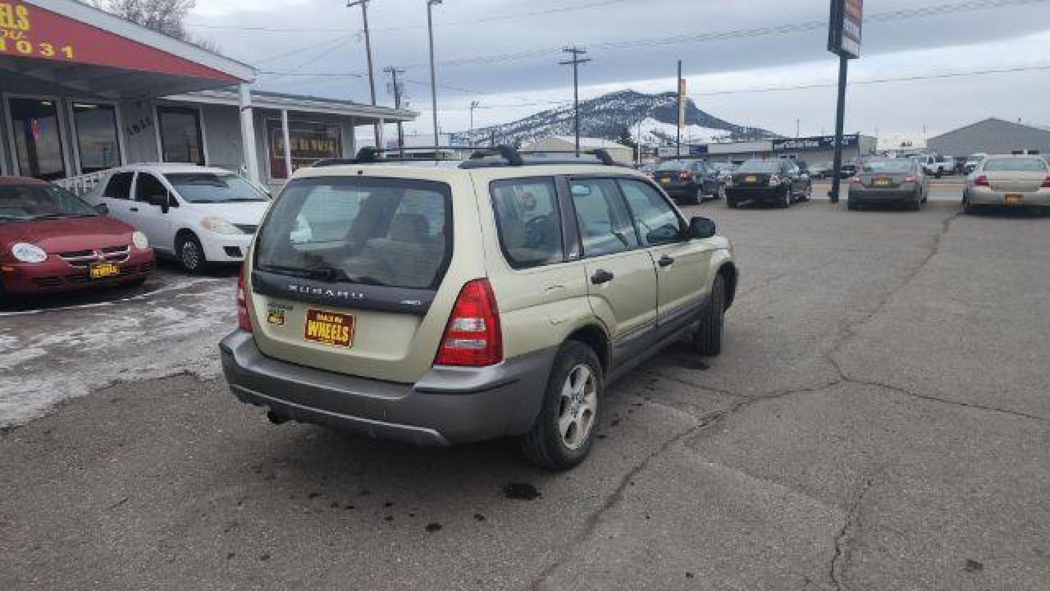 2004 Sierra Gold Metallic/Steel Gray Metallic Subaru Forester 2.5 XS (JF1SG65664G) with an 2.5L H4 SOHC 16V engine, 5-Speed Manual transmission, located at 1821 N Montana Ave, Helena, MT, 59601, (406) 543-1986, 46.603153, -112.020531 - Photo #1