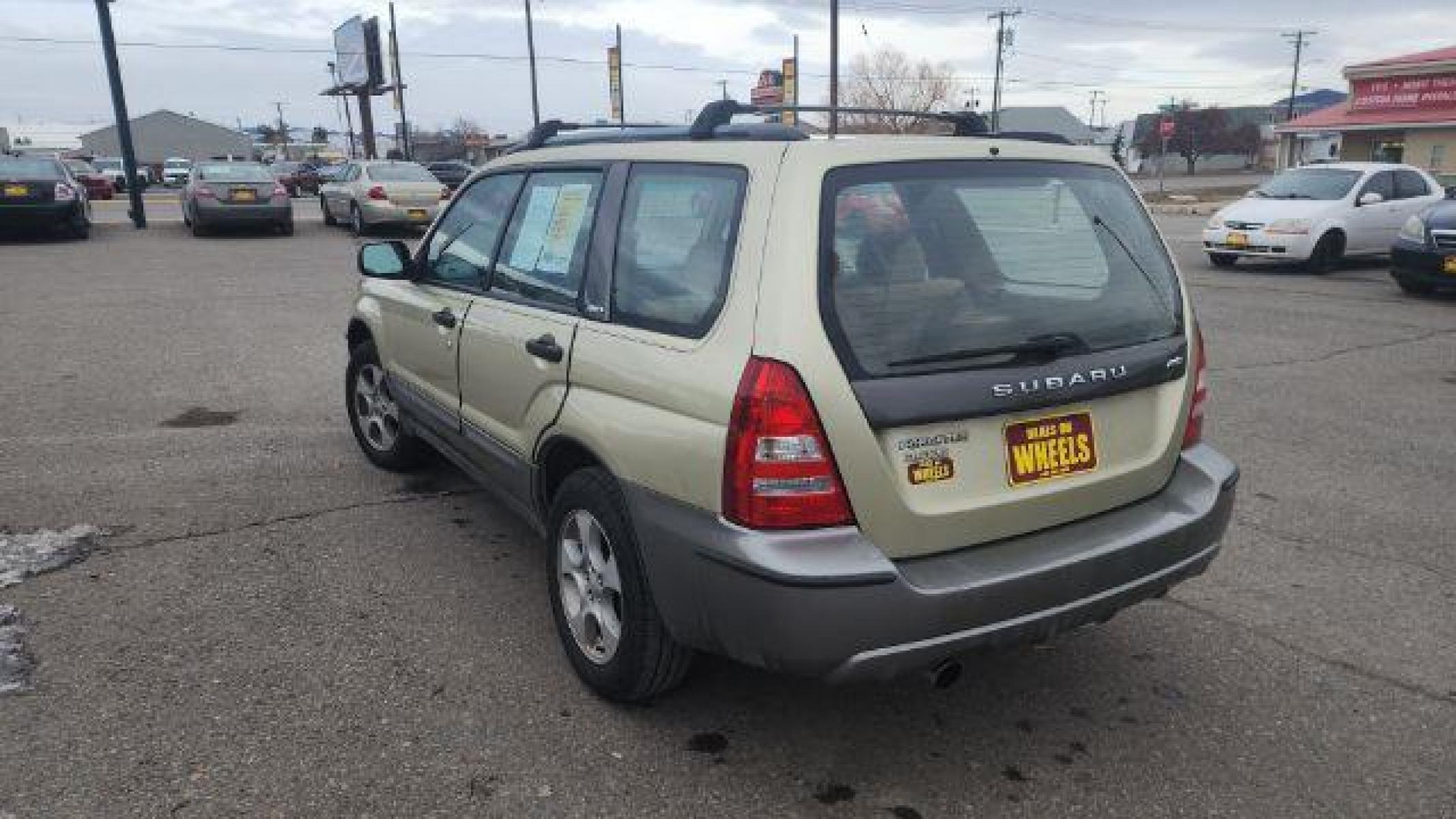 2004 Sierra Gold Metallic/Steel Gray Metallic Subaru Forester 2.5 XS (JF1SG65664G) with an 2.5L H4 SOHC 16V engine, 5-Speed Manual transmission, located at 1821 N Montana Ave, Helena, MT, 59601, (406) 543-1986, 46.603153, -112.020531 - Photo #3