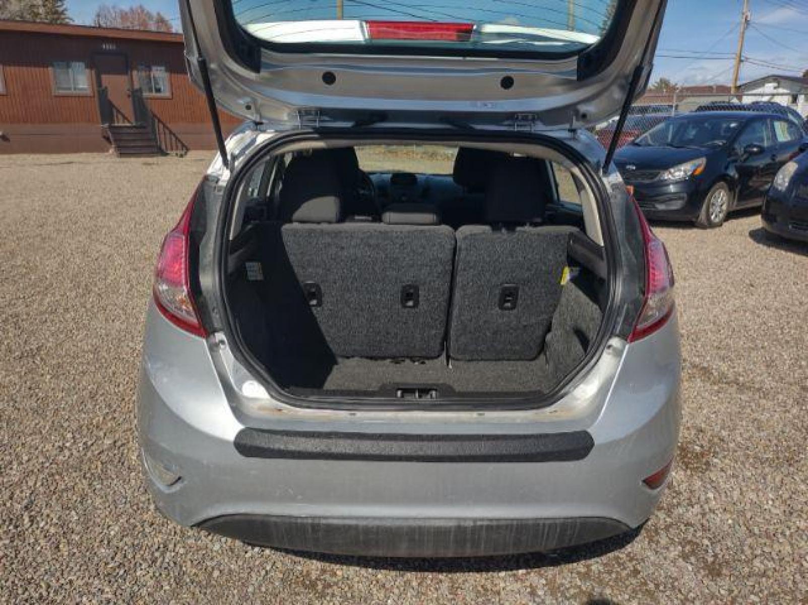 2015 Ingot Silver Metallic /Charcoal Black w/Red Ford Fiesta SE Hatchback (3FADP4EJ1FM) with an 1.6L L4 DOHC 16V engine, 6-Speed Automatic transmission, located at 4801 10th Ave S,, Great Falls, MT, 59405, (406) 564-1505, 47.494347, -111.232239 - Photo #12