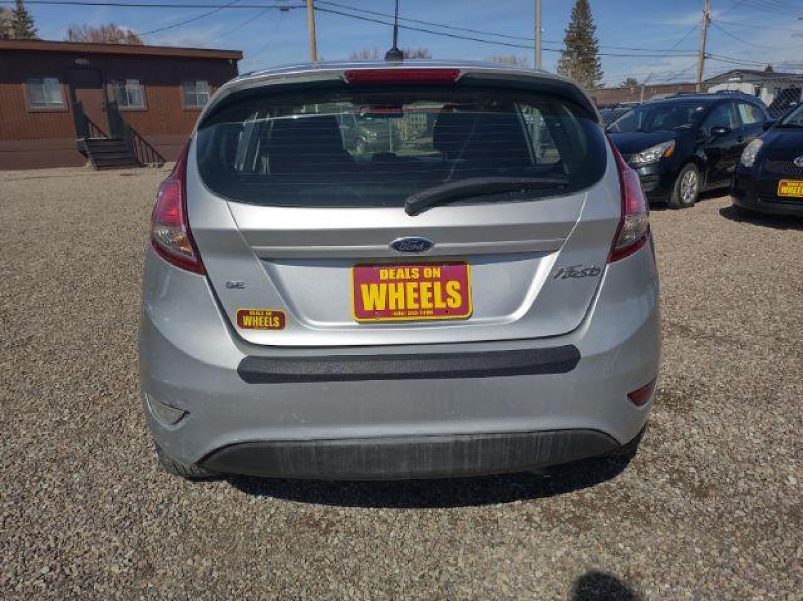 2015 Ingot Silver Metallic /Charcoal Black w/Red Ford Fiesta SE Hatchback (3FADP4EJ1FM) with an 1.6L L4 DOHC 16V engine, 6-Speed Automatic transmission, located at 4801 10th Ave S,, Great Falls, MT, 59405, (406) 564-1505, 47.494347, -111.232239 - Photo #3