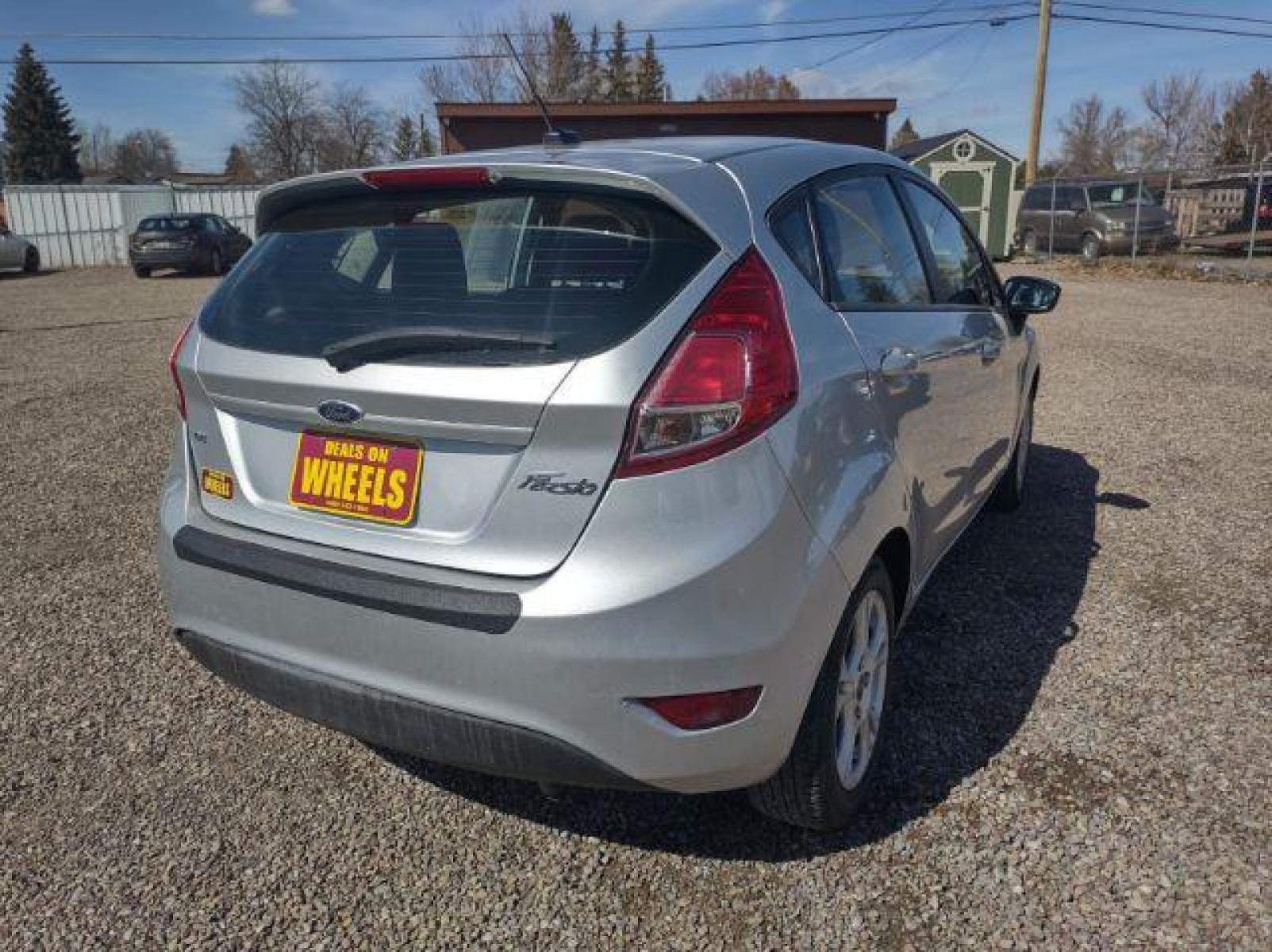 2015 Ingot Silver Metallic /Charcoal Black w/Red Ford Fiesta SE Hatchback (3FADP4EJ1FM) with an 1.6L L4 DOHC 16V engine, 6-Speed Automatic transmission, located at 4801 10th Ave S,, Great Falls, MT, 59405, (406) 564-1505, 47.494347, -111.232239 - Photo #4
