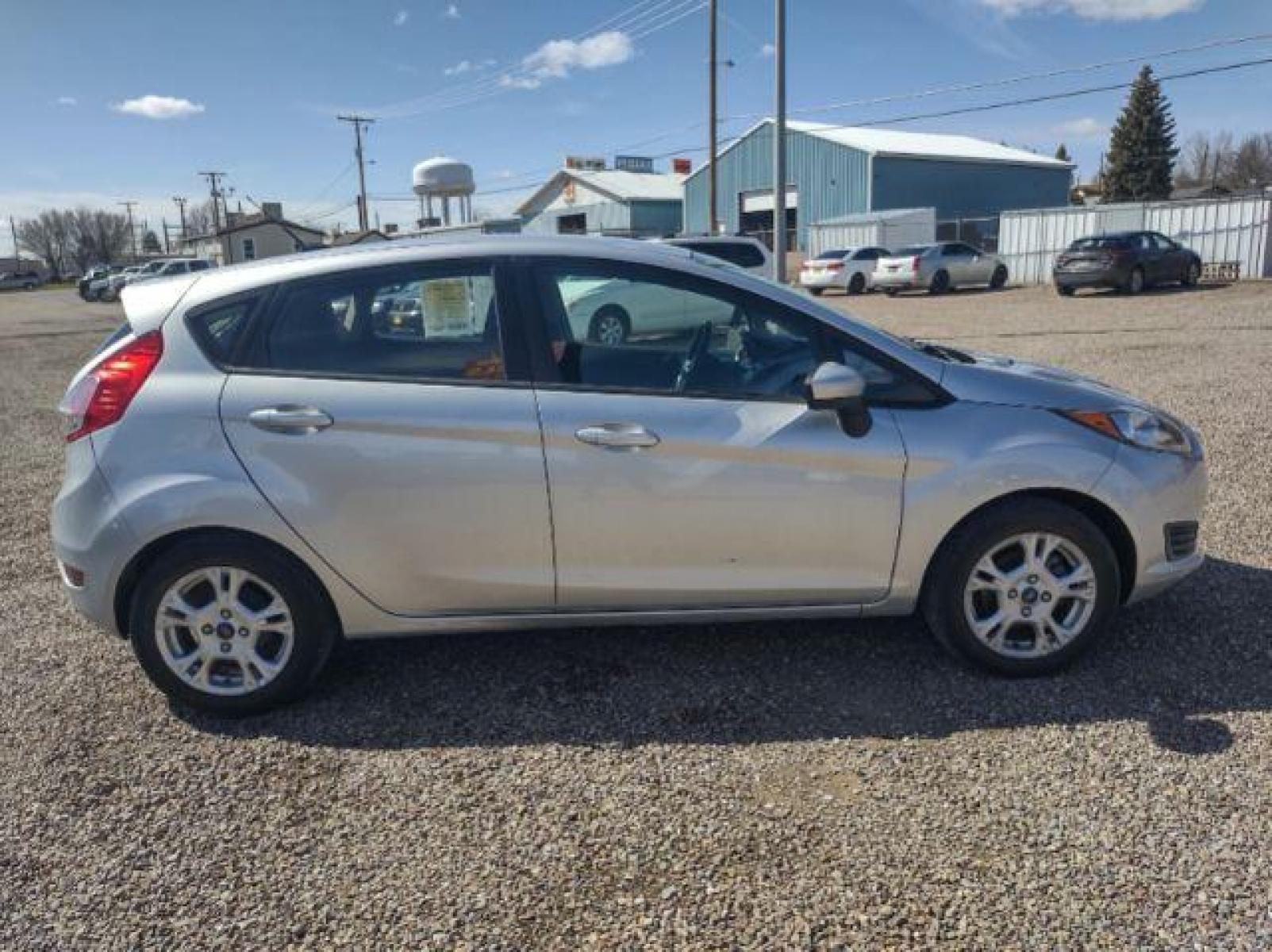 2015 Ingot Silver Metallic /Charcoal Black w/Red Ford Fiesta SE Hatchback (3FADP4EJ1FM) with an 1.6L L4 DOHC 16V engine, 6-Speed Automatic transmission, located at 4801 10th Ave S,, Great Falls, MT, 59405, (406) 564-1505, 47.494347, -111.232239 - Photo #5