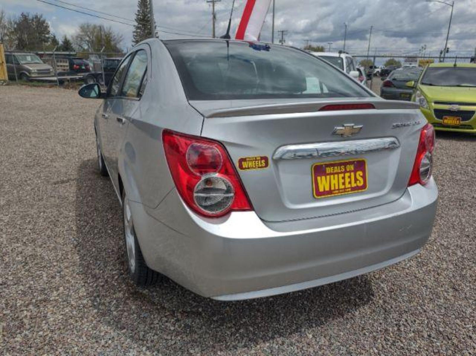 2013 Chevrolet Sonic LTZ Auto Sedan (1G1JE5SH0D4) with an 1.8L L4 DOHC 24V engine, 6-Speed Automatic transmission, located at 4801 10th Ave S,, Great Falls, MT, 59405, (406) 564-1505, 47.494347, -111.232239 - Photo #2