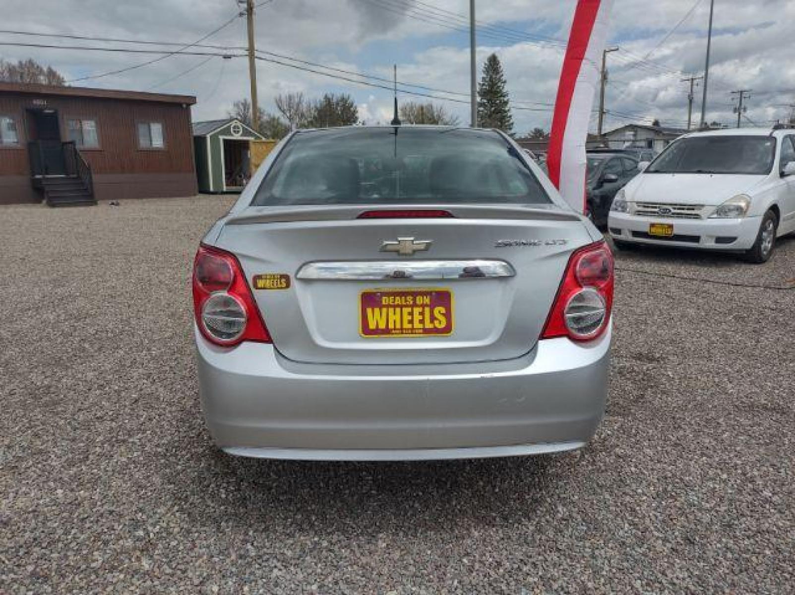 2013 Chevrolet Sonic LTZ Auto Sedan (1G1JE5SH0D4) with an 1.8L L4 DOHC 24V engine, 6-Speed Automatic transmission, located at 4801 10th Ave S,, Great Falls, MT, 59405, (406) 564-1505, 47.494347, -111.232239 - Photo #3