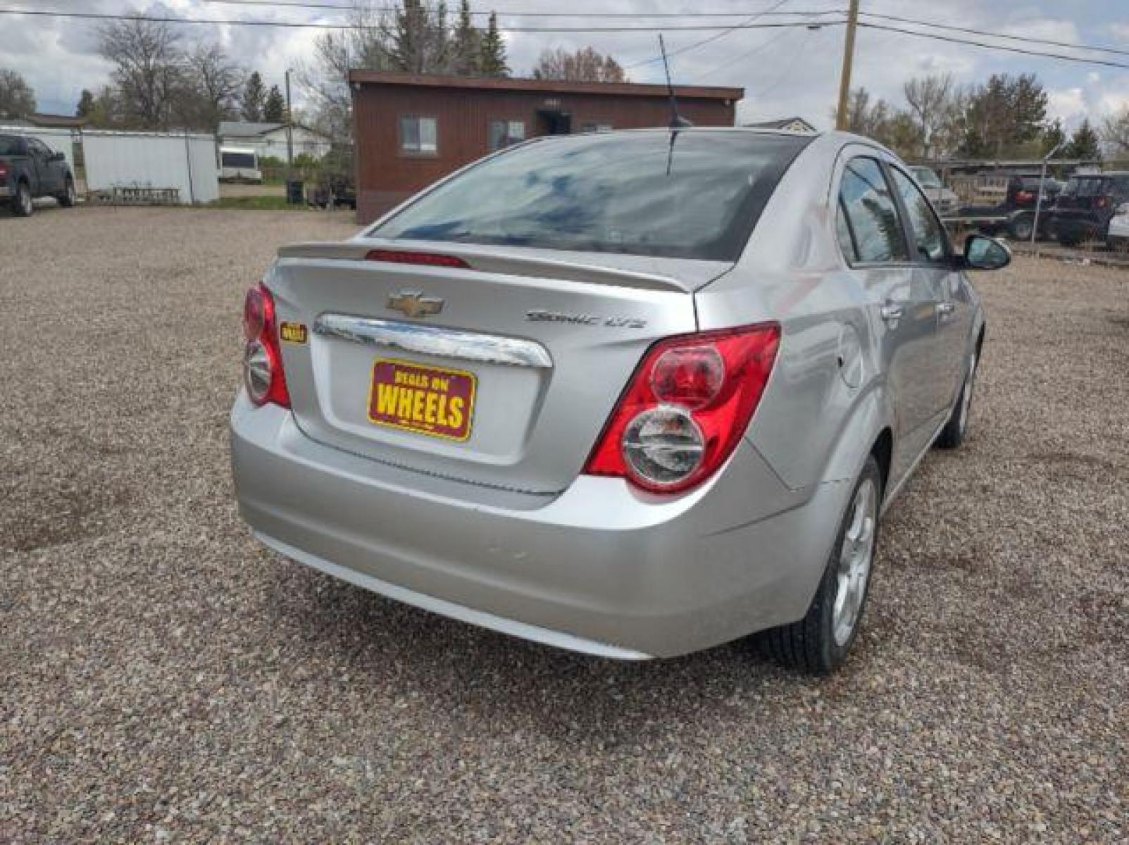2013 Chevrolet Sonic LTZ Auto Sedan (1G1JE5SH0D4) with an 1.8L L4 DOHC 24V engine, 6-Speed Automatic transmission, located at 4801 10th Ave S,, Great Falls, MT, 59405, (406) 564-1505, 47.494347, -111.232239 - Photo #4