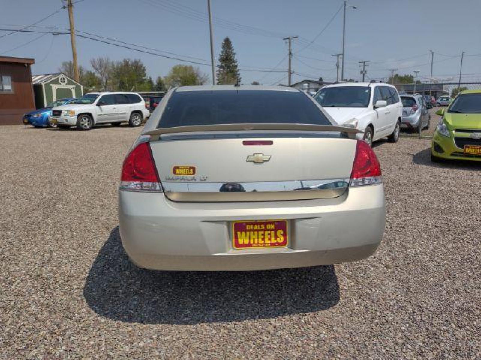 2010 Chevrolet Impala LT (2G1WB5ENXA1) with an 3.5L V6 OHV 12V engine, 4-Speed Automatic transmission, located at 4801 10th Ave S,, Great Falls, MT, 59405, (406) 564-1505, 47.494347, -111.232239 - Photo #3