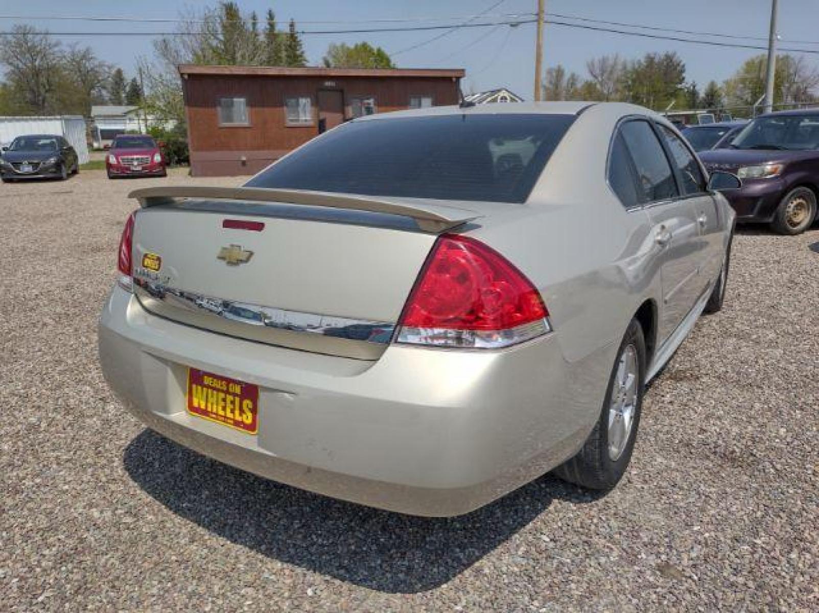 2010 Chevrolet Impala LT (2G1WB5ENXA1) with an 3.5L V6 OHV 12V engine, 4-Speed Automatic transmission, located at 4801 10th Ave S,, Great Falls, MT, 59405, (406) 564-1505, 47.494347, -111.232239 - Photo #4
