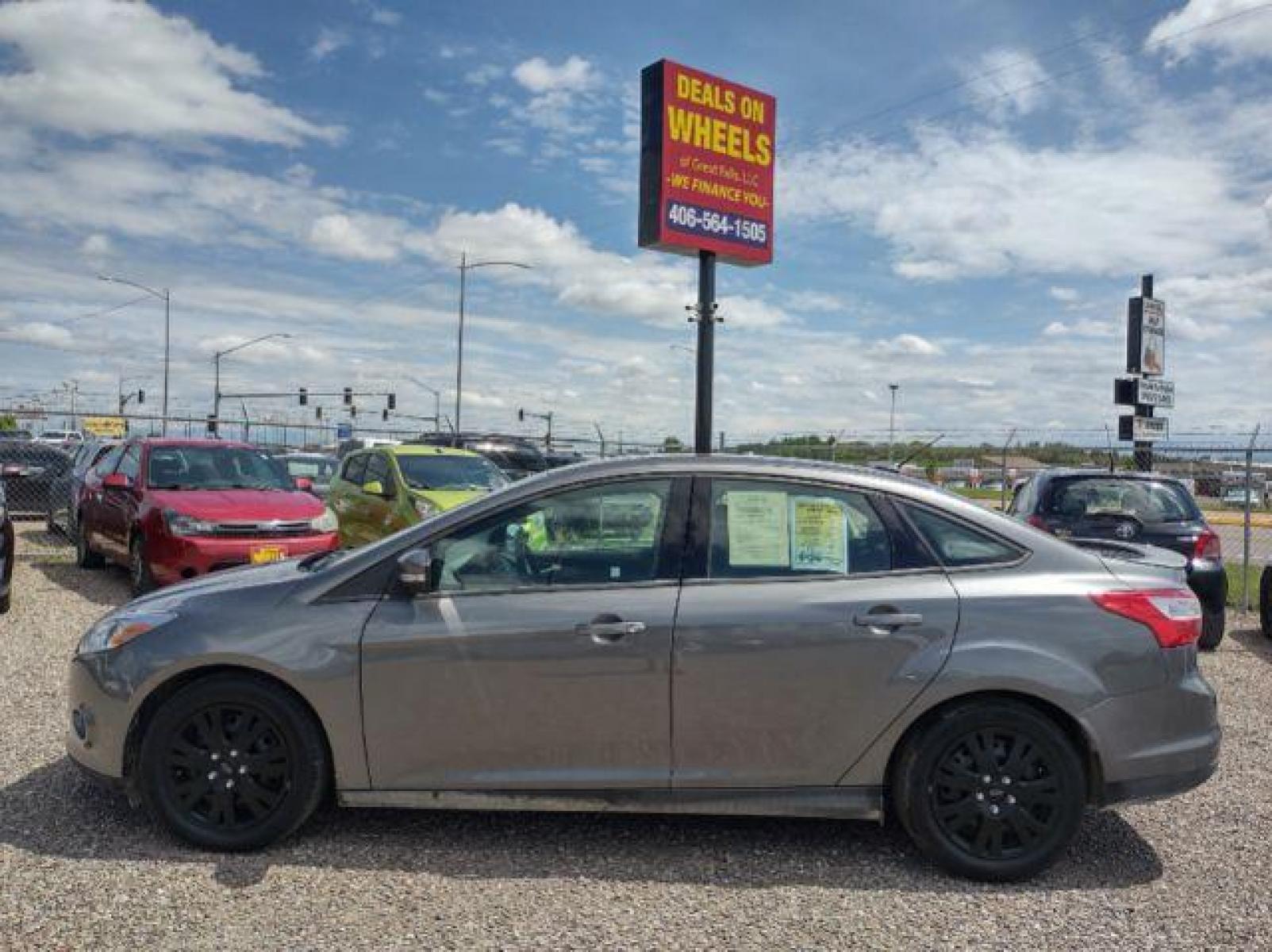 2014 Sterling Gray Metallic Ford Focus SE Sedan (1FADP3F23EL) with an 2.0L L4 DOHC 16V engine, located at 4801 10th Ave S,, Great Falls, MT, 59405, (406) 564-1505, 47.494347, -111.232239 - Photo #1