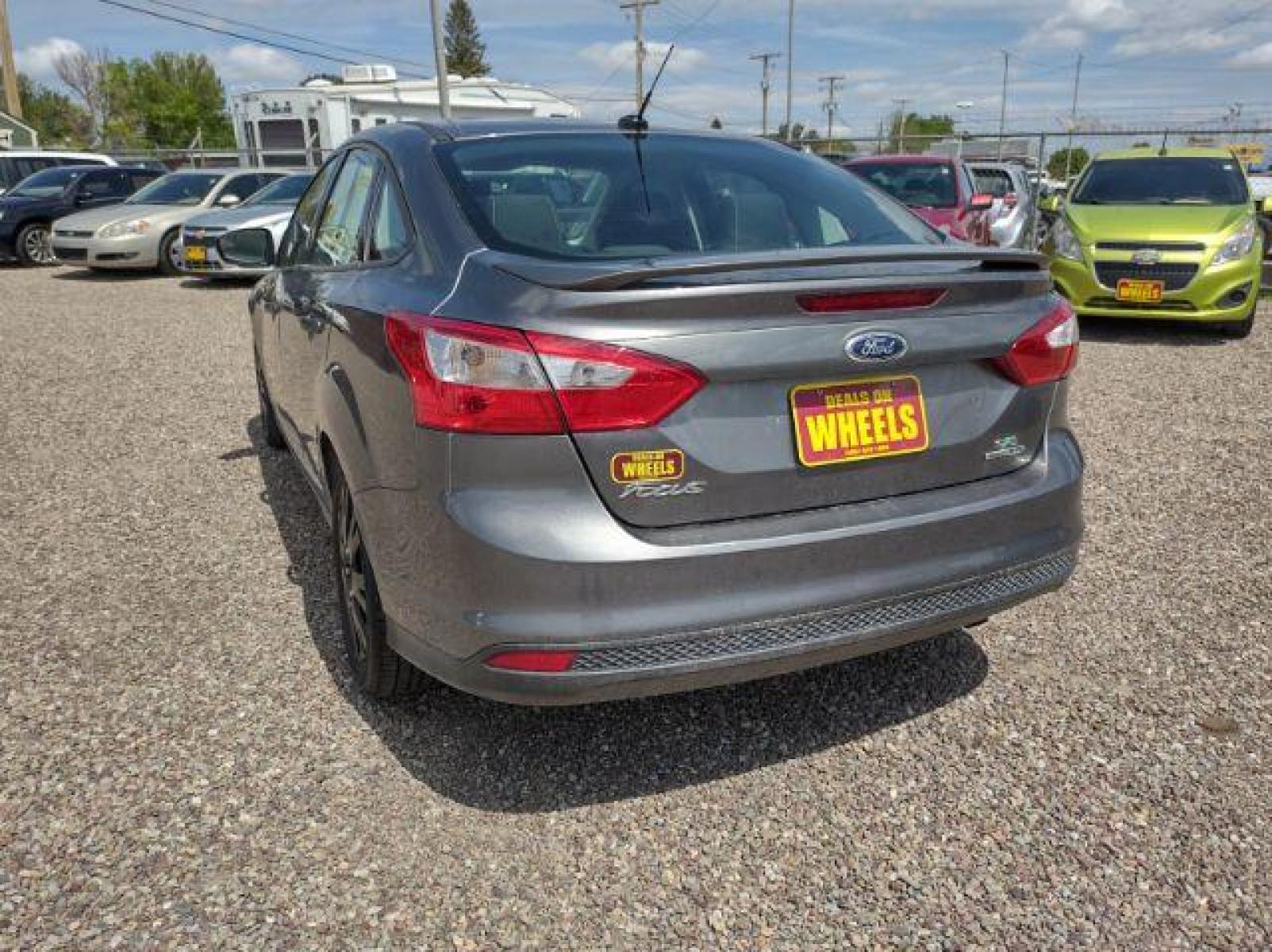 2014 Sterling Gray Metallic Ford Focus SE Sedan (1FADP3F23EL) with an 2.0L L4 DOHC 16V engine, located at 4801 10th Ave S,, Great Falls, MT, 59405, (406) 564-1505, 47.494347, -111.232239 - Photo #2