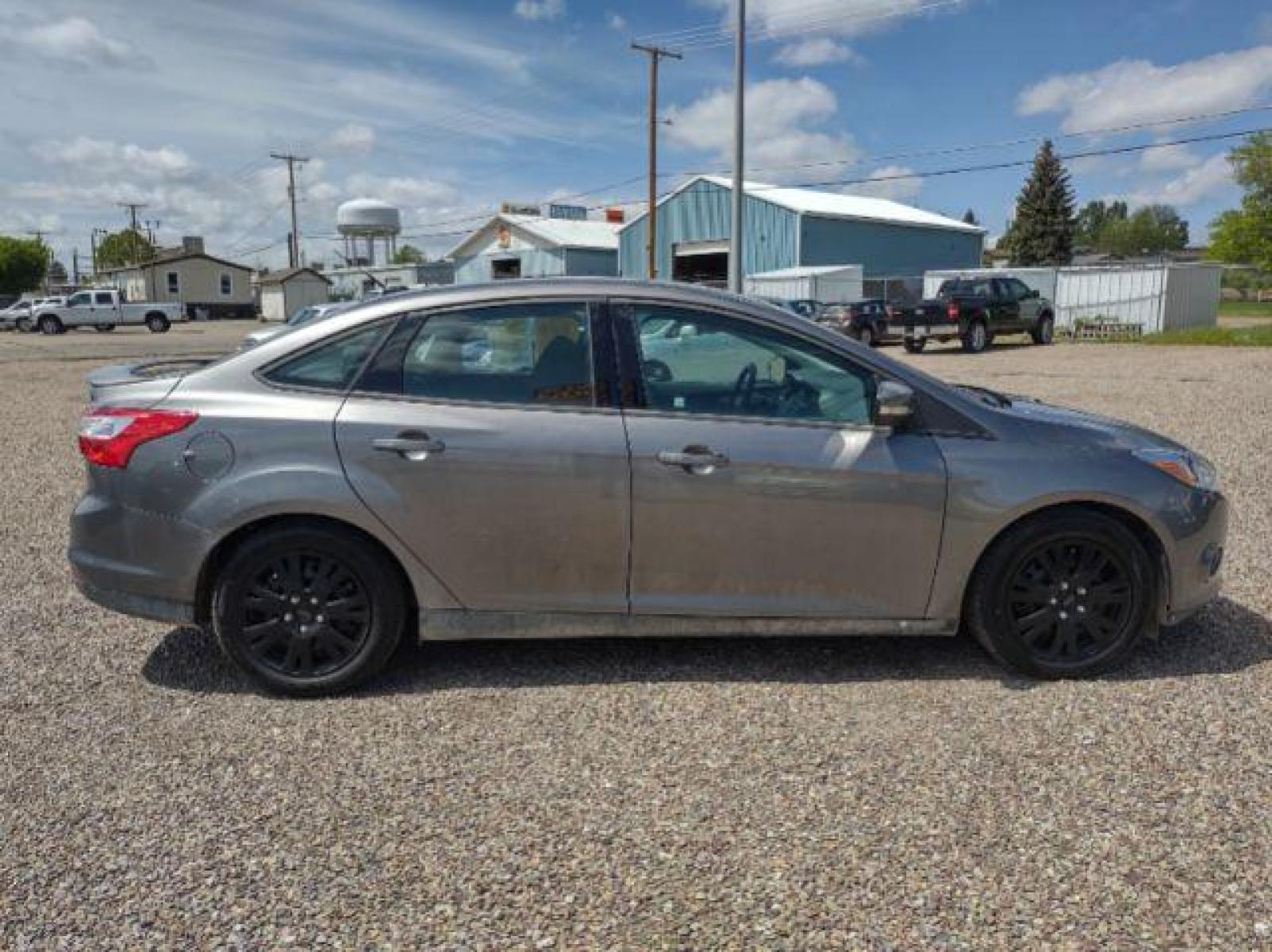 2014 Sterling Gray Metallic Ford Focus SE Sedan (1FADP3F23EL) with an 2.0L L4 DOHC 16V engine, located at 4801 10th Ave S,, Great Falls, MT, 59405, (406) 564-1505, 47.494347, -111.232239 - Photo #5