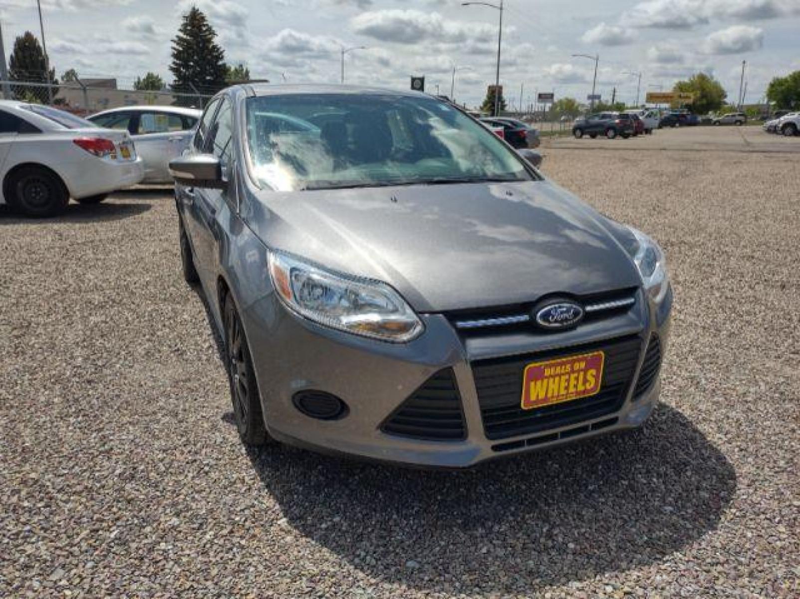 2014 Sterling Gray Metallic Ford Focus SE Sedan (1FADP3F23EL) with an 2.0L L4 DOHC 16V engine, located at 4801 10th Ave S,, Great Falls, MT, 59405, (406) 564-1505, 47.494347, -111.232239 - Photo #6