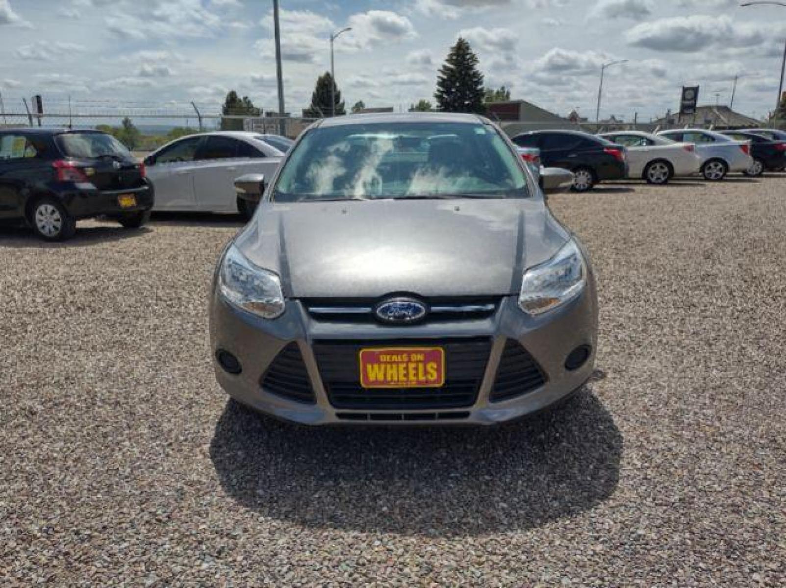 2014 Sterling Gray Metallic Ford Focus SE Sedan (1FADP3F23EL) with an 2.0L L4 DOHC 16V engine, located at 4801 10th Ave S,, Great Falls, MT, 59405, (406) 564-1505, 47.494347, -111.232239 - Photo #7