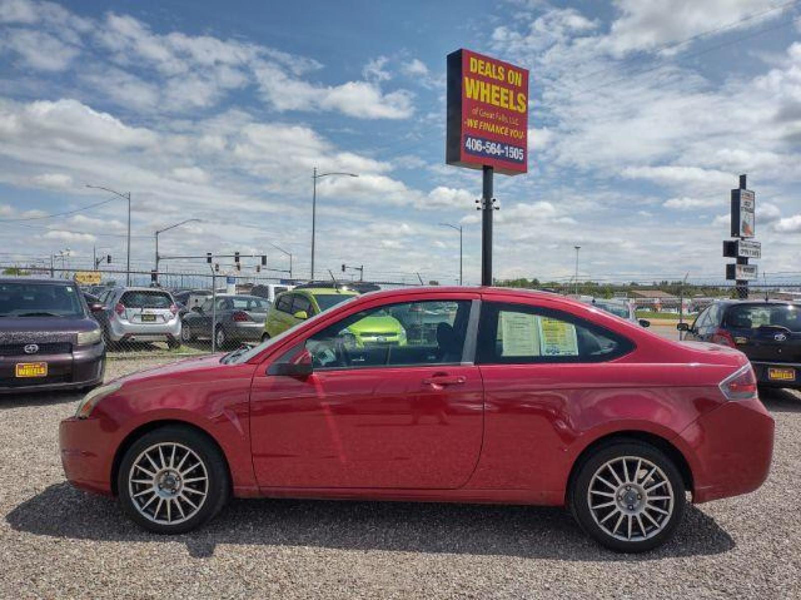 2009 Ford Focus SES Coupe (1FAHP33NX9W) with an 2.0L L4 DOHC 16V engine, located at 4801 10th Ave S,, Great Falls, MT, 59405, (406) 564-1505, 47.494347, -111.232239 - Photo #1