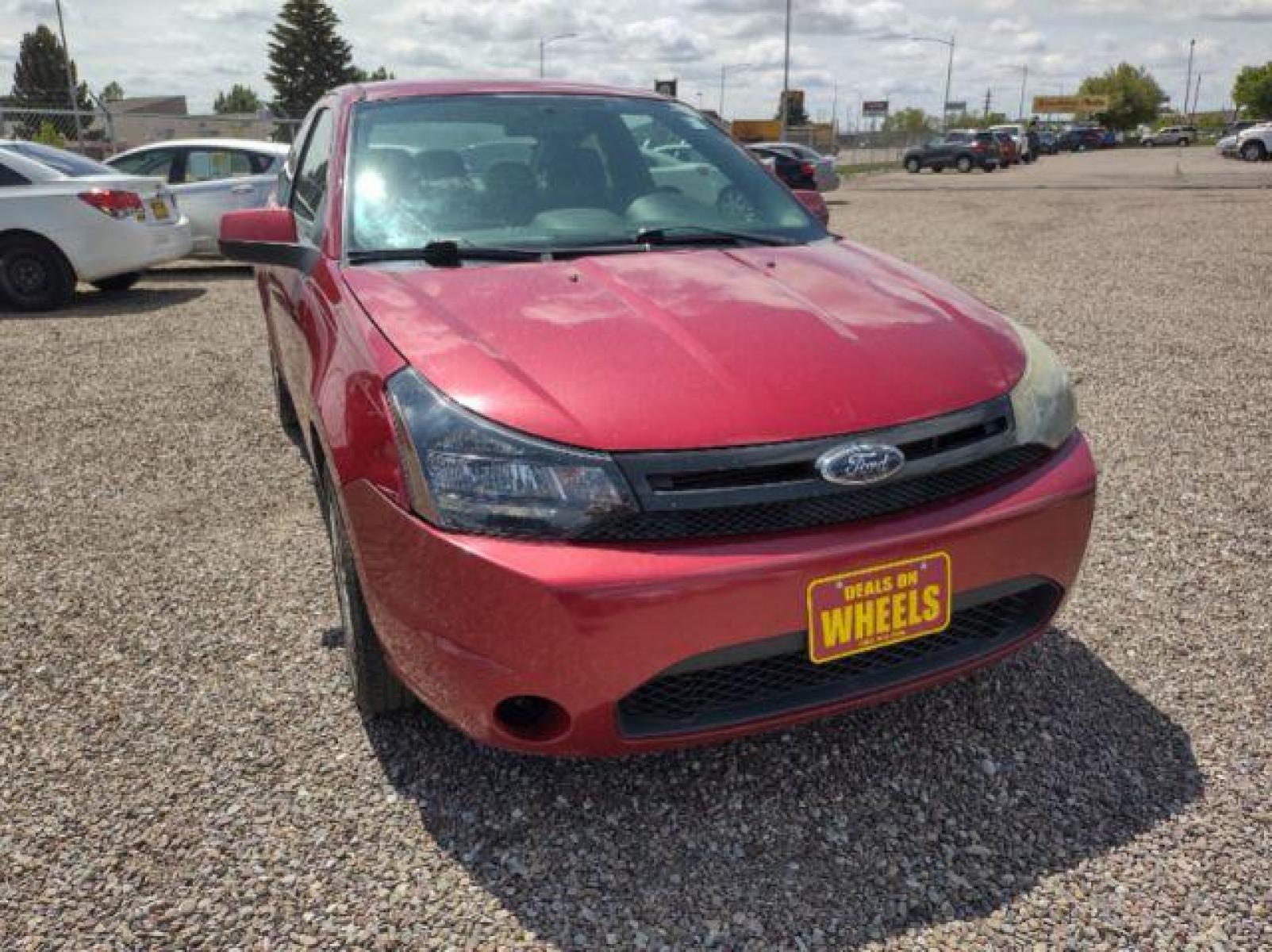 2009 Ford Focus SES Coupe (1FAHP33NX9W) with an 2.0L L4 DOHC 16V engine, located at 4801 10th Ave S,, Great Falls, MT, 59405, (406) 564-1505, 47.494347, -111.232239 - Photo #3