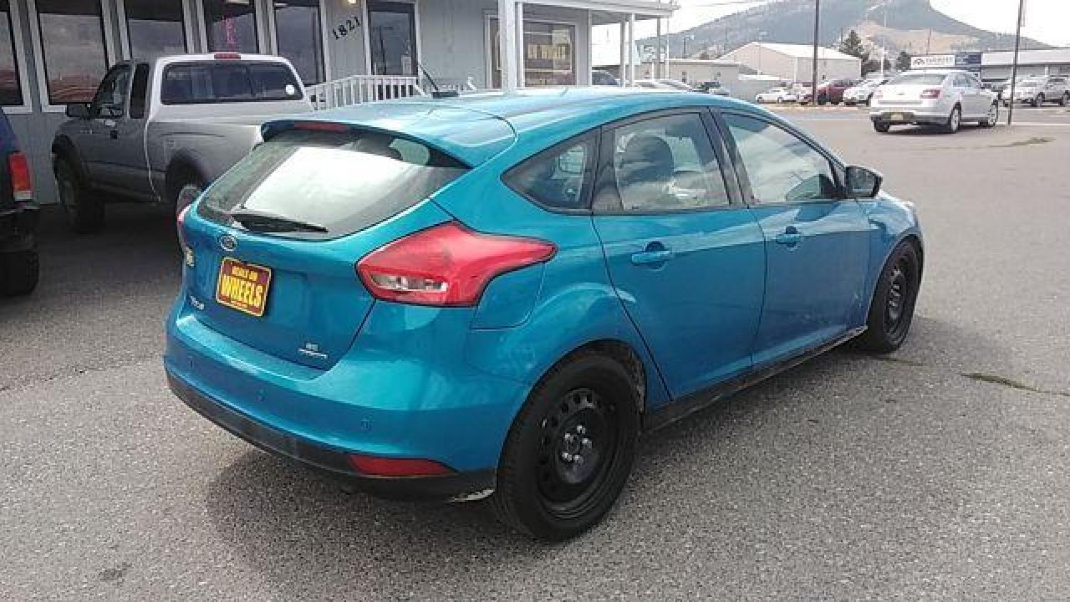 2015 Ford Focus SE Hatch (1FADP3K29FL) with an 2.0L L4 DOHC 16V engine, 5-Speed Manual transmission, located at 1821 N Montana Ave, Helena, MT, 59601, (406) 422-1031, 46.603447, -112.022781 - Photo #4